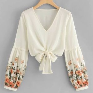 A floral chiffon self tie crop top